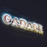 "Garage" white neon sign with dark background