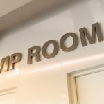 gold-vip-room-sign-front-room-with-warm-light-effect-special-guests-attending-meeting