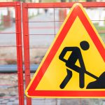 Sidewalk or road blocked with a sign - repair of communications